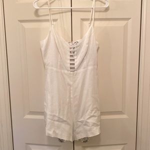 Super cute white romper. Great for a honeymoon, bachelorette party, or vacay!